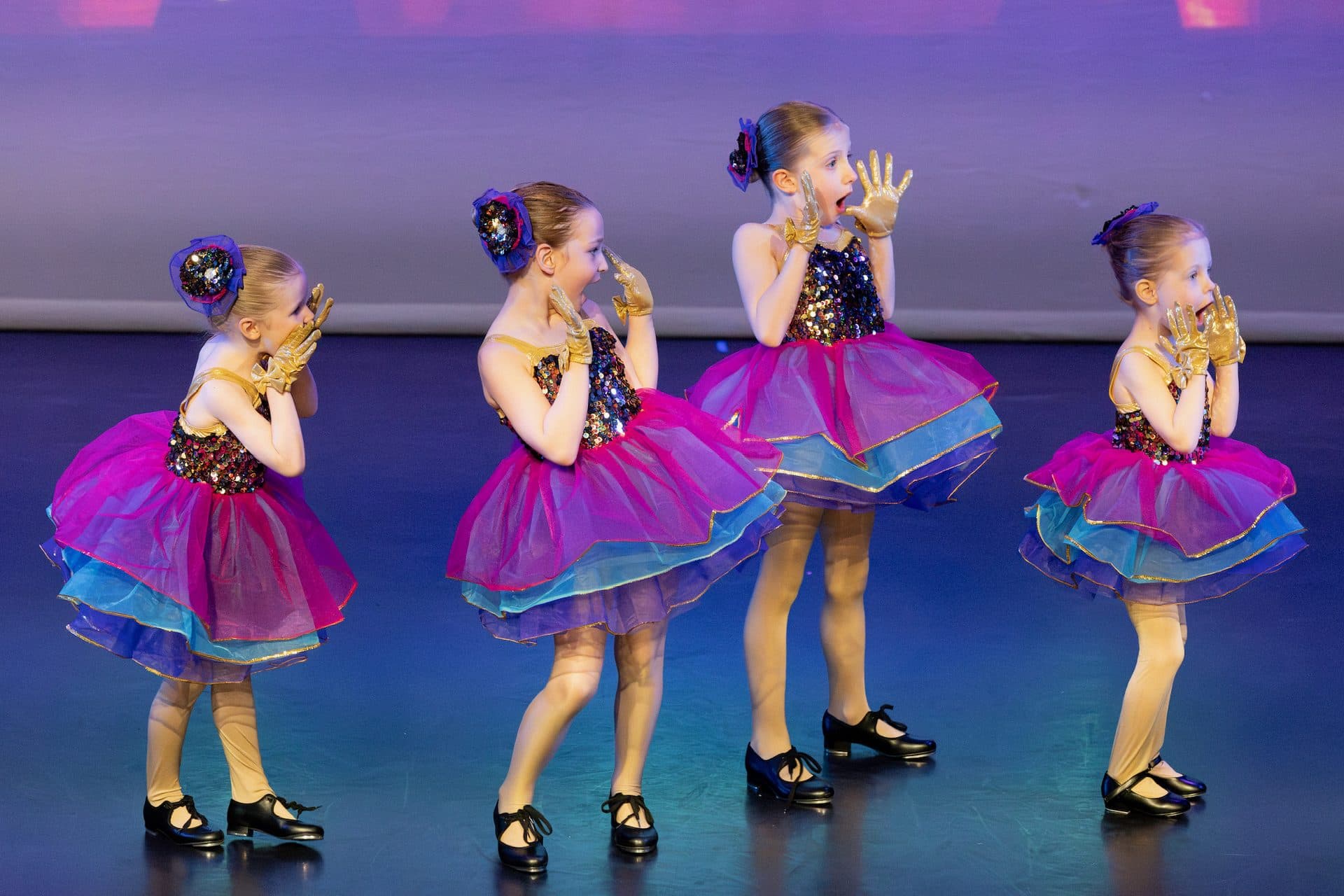 Tap students performing together on stage